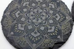 Multicolor mandala engraving on slate coaster